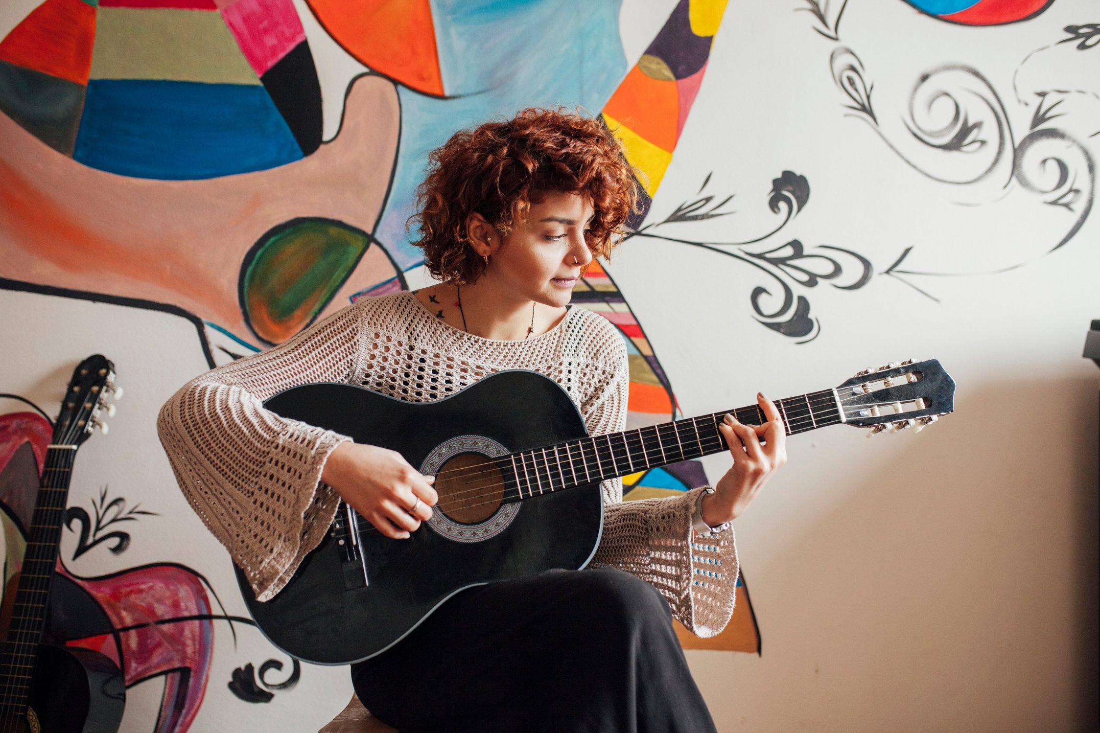 Woman playing guitar